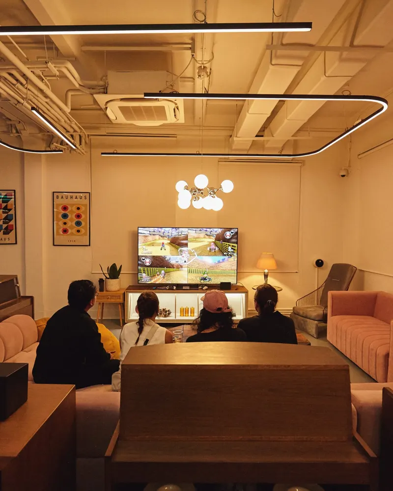 Team unwinding over a game in the studio lounge